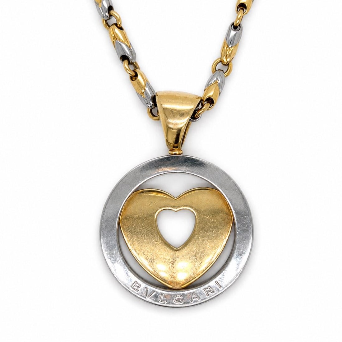 Bvlgari Two Tone 18K Gold Steel Necklace Pendant 16 Inch Chain: Bvlgari Two Tone 18K Gold Steel Necklace Pendant 16 Inch Chain This BVLGARI necklace features a sophisticated combination of 18K yellow gold and stainless steel. The pendant measures 1.75 inches in le