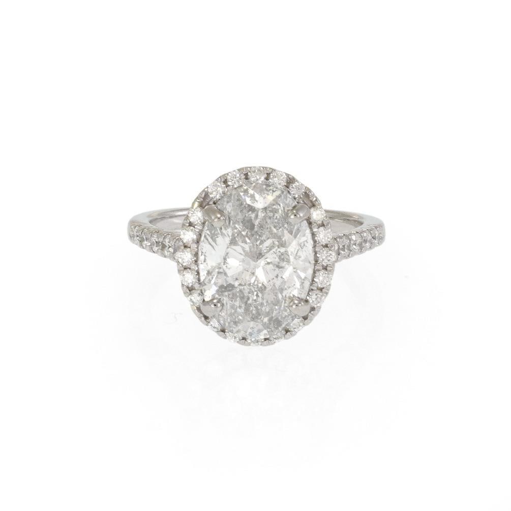 Halo Engagement Ring 4.37ct Oval Diamond Platinum Size 6.5: Halo Engagement Ring 4.37ct Oval Diamond Platinum Size 6.5 Presenting a breathtaking engagement halo ring, meticulously crafted from high-quality platinum. This exquisite ring features a polished fini