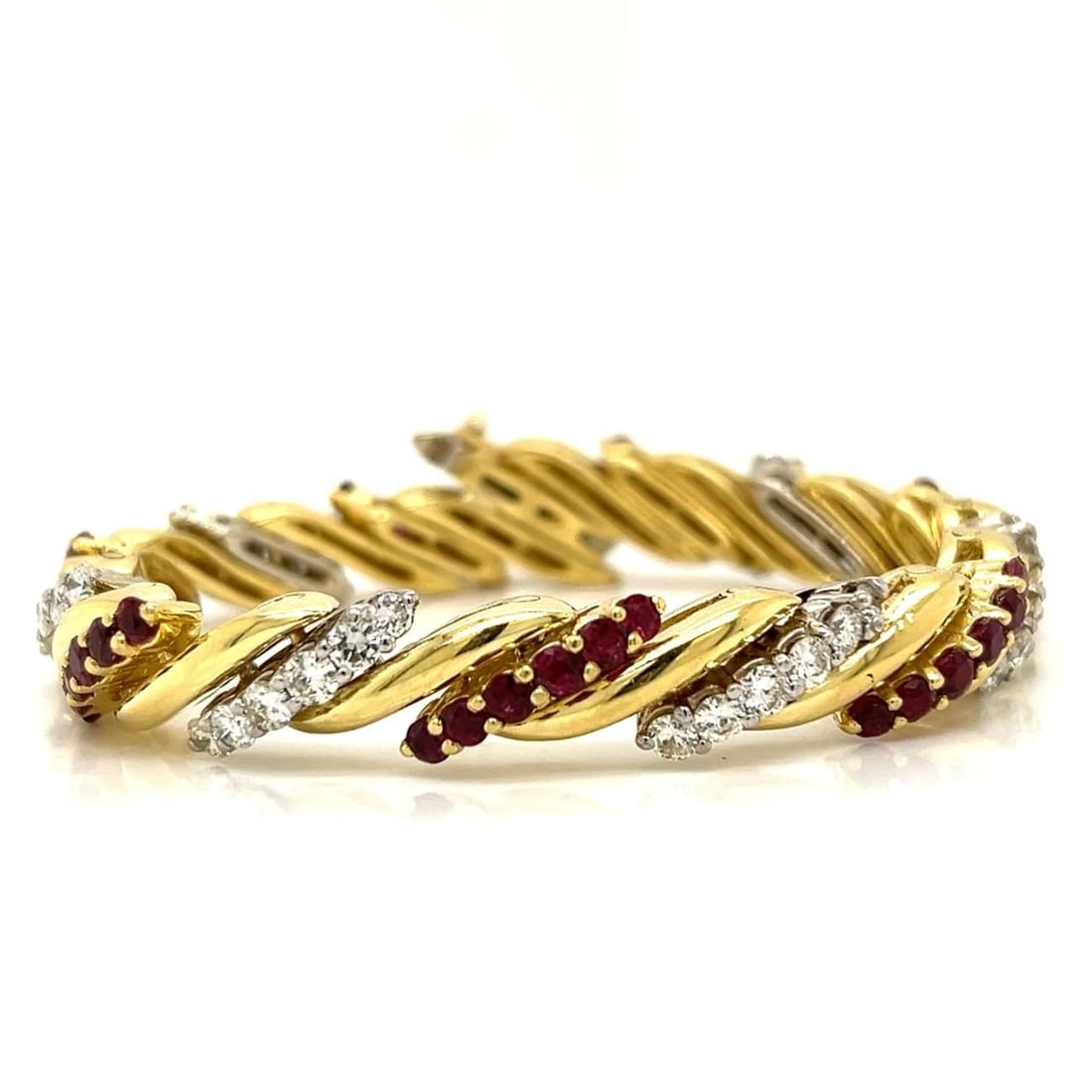 1960s 18K Yellow Gold Ruby Diamond Bracelet 42 Stones 5.50 Ct Each: 1960s 18K Yellow Gold Ruby Diamond Bracelet 42 Stones 5.50 Ct Each This exquisite 1960s bracelet is crafted in 18K yellow gold, featuring a stunning combination of rubies and diamonds. Weighing 58.5 g