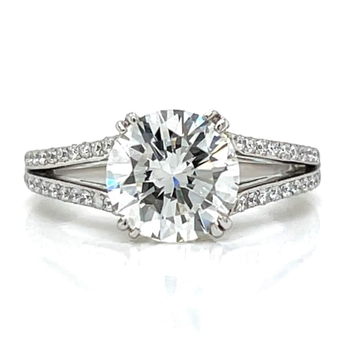 DANIEL K. Platinum 2.00 Ct. Diamond Ring with 74 Accent Diamonds: DANIEL K. Platinum 2.00 Ct. Diamond Ring with 74 Accent Diamonds This exquisite DANIEL K. Platinum Diamond Ring features a stunning 2.00 Ct. diamond at its center, displaying H color and VVS1 clarity.