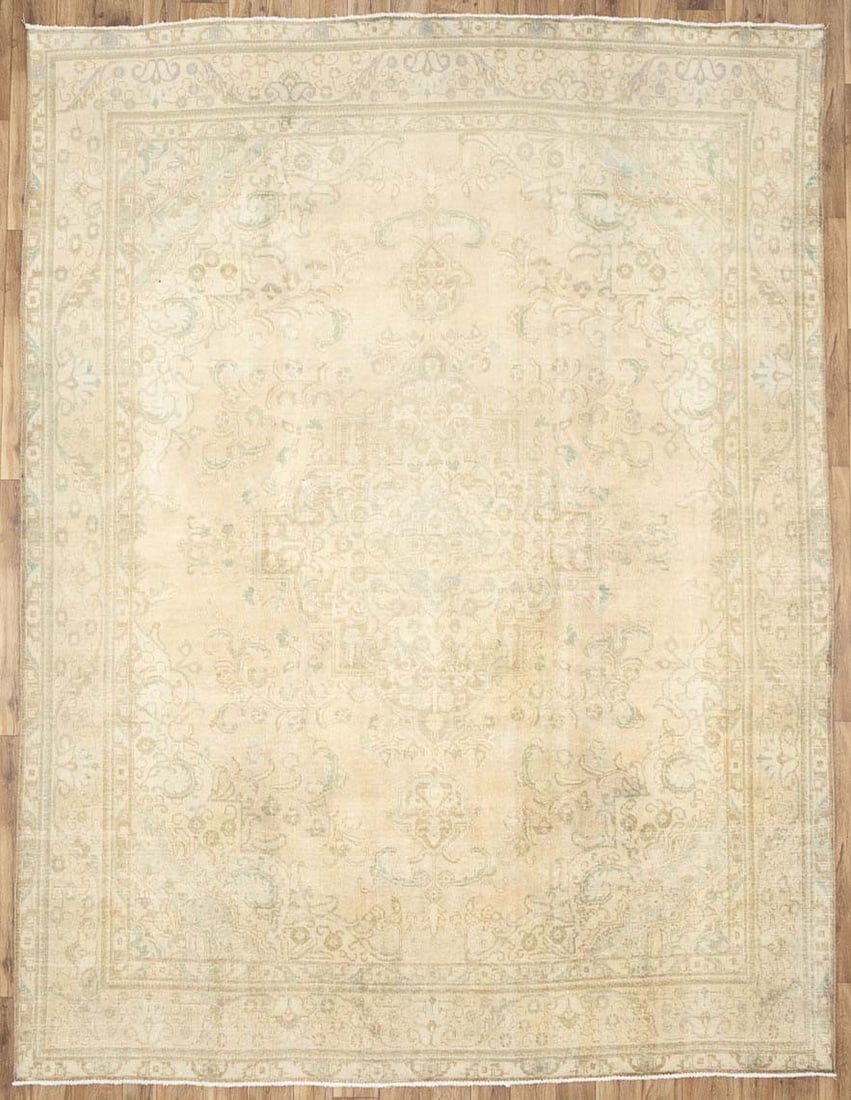 Hand-knotted wool floral area rug 9'6 x 12'5: Hand-knotted wool floral area rug 9'6 x 12'5 This semi-antique handmade Oriental rug features a distressed floral pattern in muted tones including beige, cream, pastel brown, and light blue. Expertly 