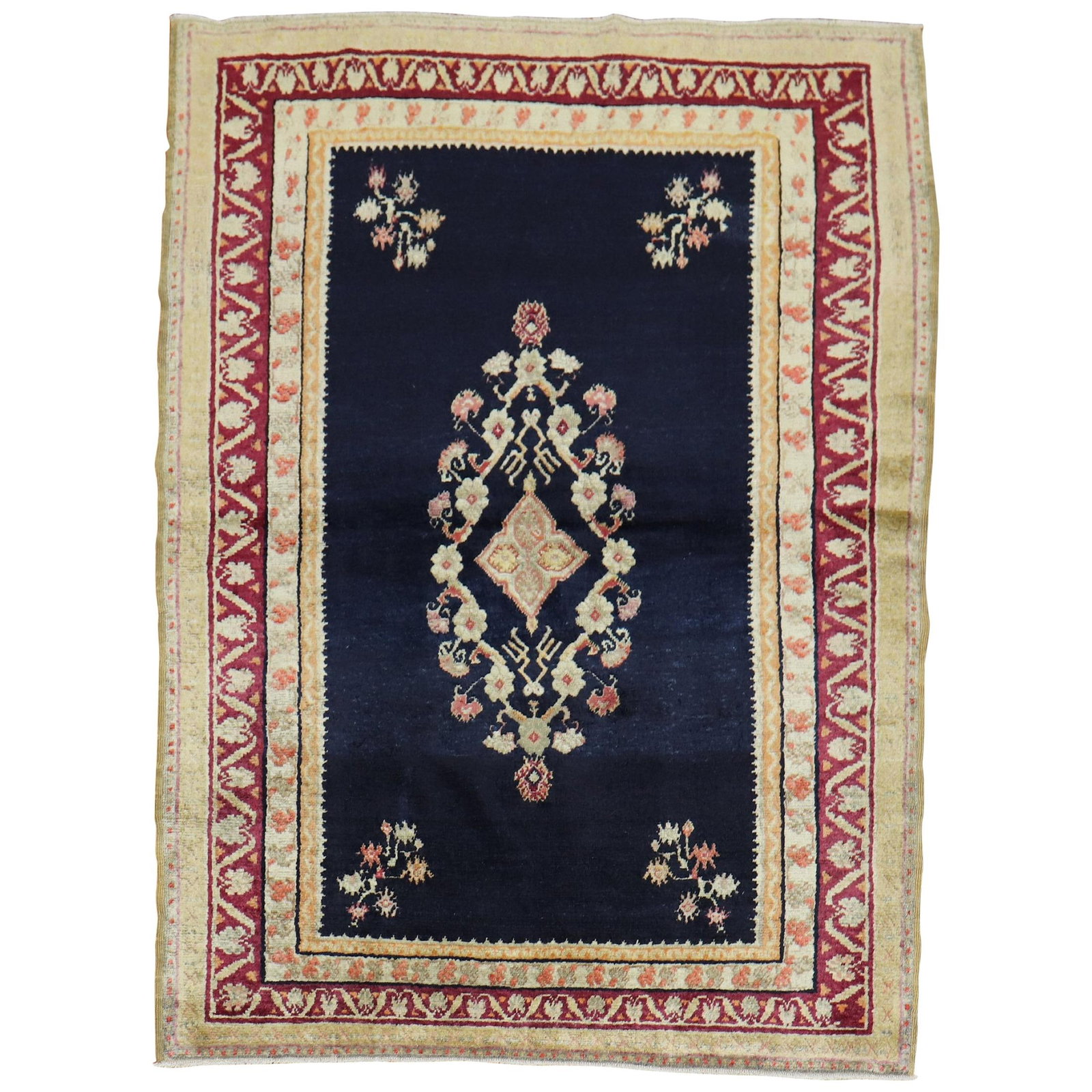 Antique Turkish Ghiordes Floral Rug 52 x 70 Hand-Knotted Wool: Antique Turkish Ghiordes Floral Rug 52 x 70 Hand-Knotted Wool This exquisite early 20th century Turkish Ghiordes rug showcases a romantic floral motif against a deep navy background. Crafted from qual