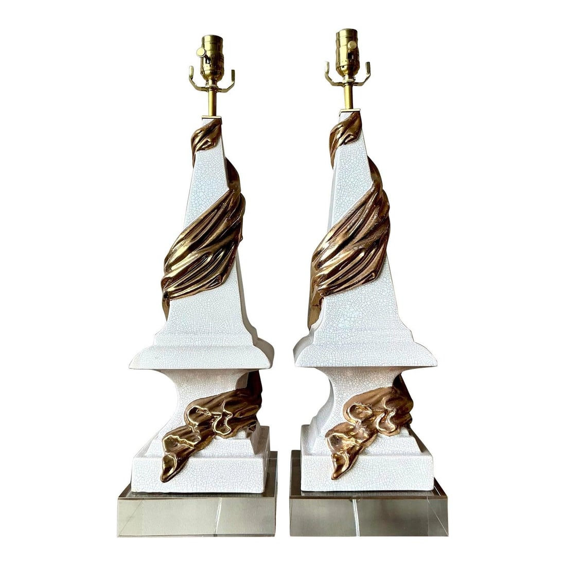 Pair of Hollywood Regency Ceramic Lamps with Gold Swag and Lucite Bases: Pair of Hollywood Regency Ceramic Lamps with Gold Swag and Lucite Bases This pair of vintage table lamps captures the essence of Hollywood Regency style with their dramatic blend of textures and finis