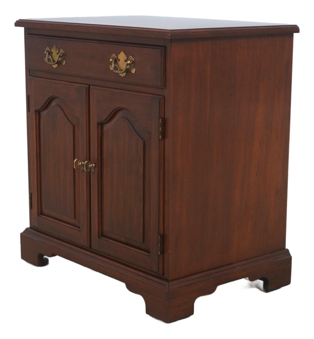 Cherry Wood Nightstand with Two Doors and Brass Hardware by Henkel Harris: Cherry Wood Nightstand with Two Doors and Brass Hardware by Henkel Harris This Henkel Harris nightstand from circa 1975 features high-quality cherry wood construction with dovetailed drawer craftsmans
