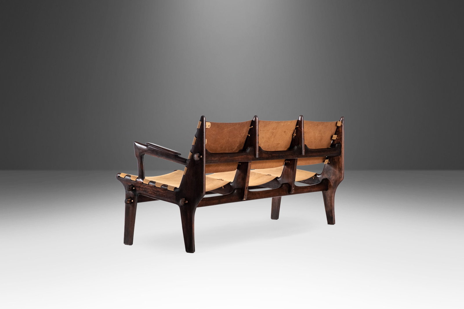 Rare Angel Pazmino Mid Century Modern 3-Seater Sofa in Fruitwood and Leather: Rare Angel Pazmino Mid Century Modern 3-Seater Sofa in Fruitwood and Leather This stunning Mid Century Modern three-seater sofa, designed by Ecuador's Angel Pazmino in the 1960s, is a captivating blen