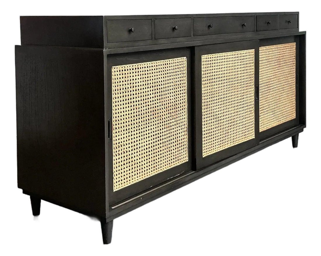 Noir cane front sideboard with six drawers: Noir cane front sideboard with six drawers The Hermosa Cane Front Credenza by Noir is a vintage piece that blends contemporary Tropical Modernism with mid-century influences. Crafted from solid hardwo