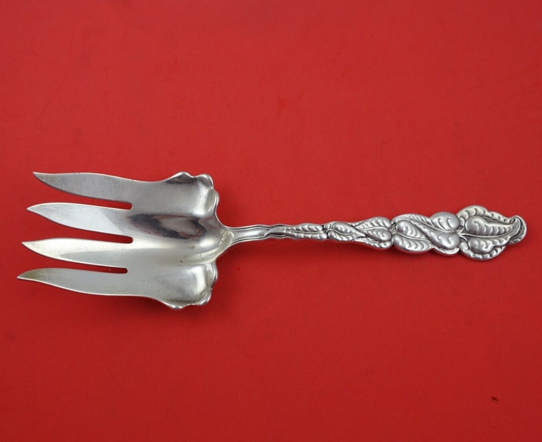 Tiffany & Co Ailanthus Sterling Silver Fish Serving Fork 9 3/8": Tiffany & Co Ailanthus Sterling Silver Fish Serving Fork 9 3/8" This exquisite fish serving fork, crafted by Tiffany & Co., features the elegant Ailanthus pattern. Made of high-quality sterling silver