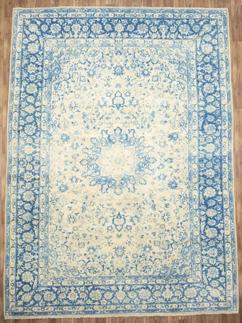 Hand Knotted Wool Floral Oriental Area Rug 9'8 x 13'2: Hand Knotted Wool Floral Oriental Area Rug 9'8 x 13'2 This semi-antique handmade Oriental rug features a classic floral pattern in muted tones of cream, navy, and light blue. Expertly hand-knotted fro
