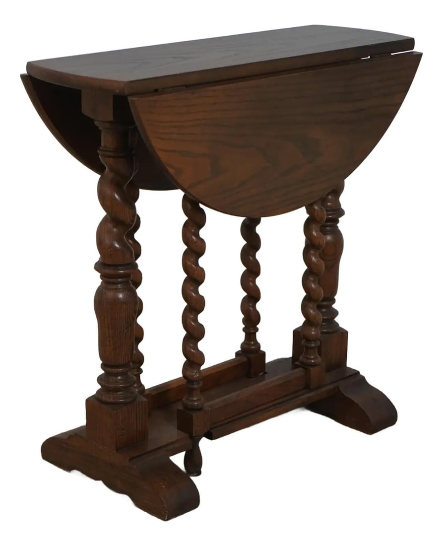 Baker Jacobean Oak Drop Leaf Table with Barley Twist Legs: Baker Jacobean Oak Drop Leaf Table with Barley Twist Legs This exquisite Baker Jacobean Style Oak Drop Leaf Table showcases fine carved details and high-quality construction, embodying the timeless el