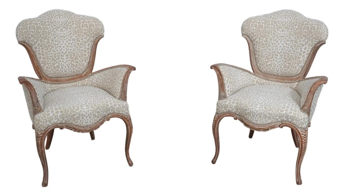 Armand Rateau Inspired Upholstered Fireside Chairs Pair in Leopard Print: Armand Rateau Inspired Upholstered Fireside Chairs Pair in Leopard Print Discover a stunning pair of Armand Rateau inspired upholstered fireside chairs, featuring exquisite curved frames with a white