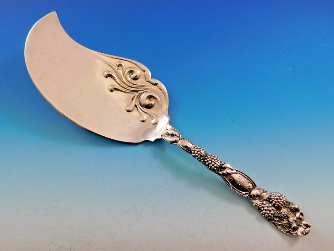 Tiffany & Co Blackberry Sterling Silver Ice Cream Server 11 1/4": Tiffany & Co Blackberry Sterling Silver Ice Cream Server 11 1/4" This stunning ice cream server from Tiffany & Co. is crafted from sterling silver and measures 11 1/4". The elegant Blackberry pattern 