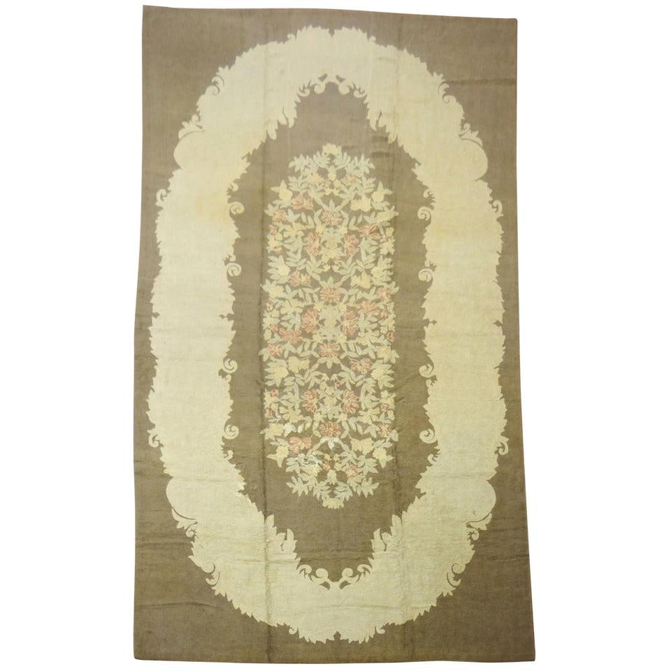 Large Handwoven Wool Rug with Brown Oval Floral Pattern Country Style 11'3" x 21'7": Large Handwoven Wool Rug with Brown Oval Floral Pattern Country Style 11'3" x 21'7" This large mid-20th century handwoven hooked rug features an oval floral design in soft brown, complemented by earth