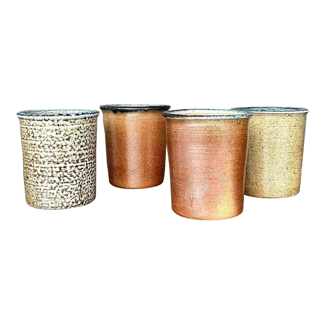 Vintage Boho Pottery Cups Set of 4 Handcrafted Charm: Vintage Boho Pottery Cups Set of 4 Handcrafted Charm Embrace the beauty of artisanal craftsmanship with this charming set of four vintage studio pottery cups. Each cup showcases unique variations in g