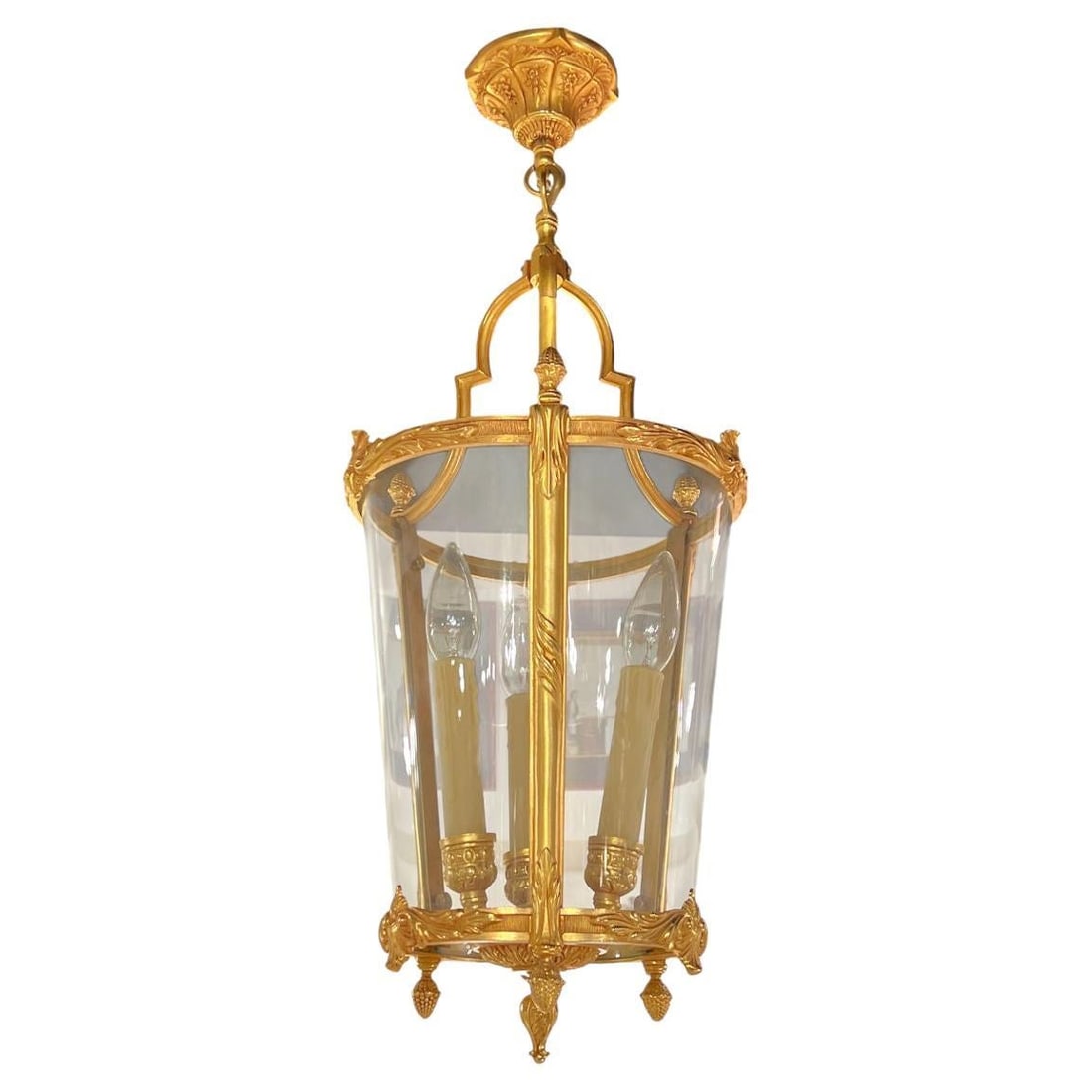 Gilt Bronze Lantern with Three Glass Panels Neoclassical French Chandelier: Gilt Bronze Lantern with Three Glass Panels Neoclassical French Chandelier This French Louis XVI style gilt bronze lantern chandelier features three electrified sockets with faux wax candle covers and