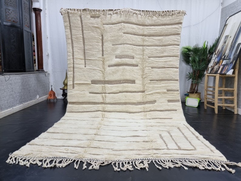 Handmade Moroccan Berber Wool Rug with Engraved Design 10 x 5 Feet: Handmade Moroccan Berber Wool Rug with Engraved Design 10 x 5 Feet Discover the beauty of this luxurious engraved rug, a stunning example of authentic artistic craftsmanship. Handcrafted by local Berb