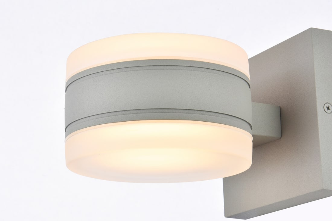Living District Raine Silver LED Outdoor Wall Sconce: Living District Raine Silver LED Outdoor Wall Sconce This modern outdoor wall sconce features a sleek silver finish and is designed for wall mounting on porches, patios, walkways, yards, or gardens. C