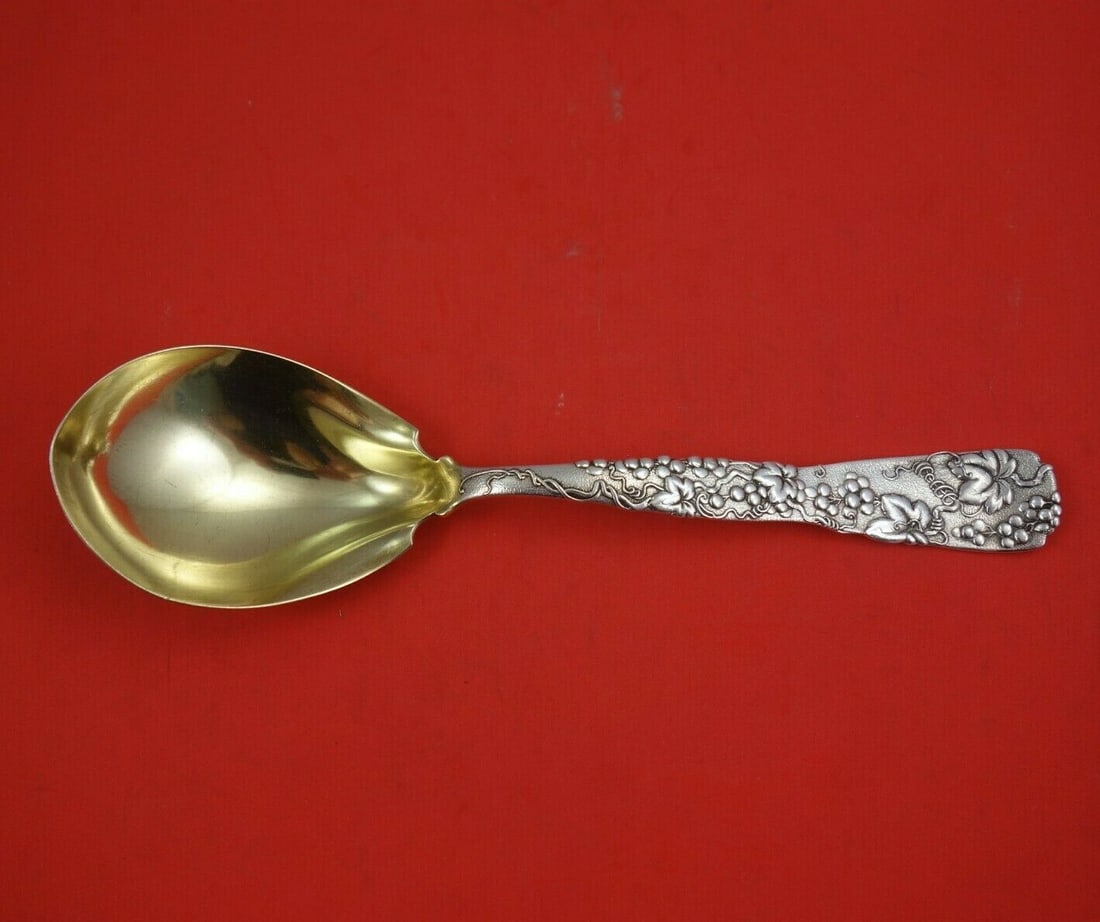 Tiffany & Co Vine Sterling Silver Berry Spoon Grapes Motif 9.5": Tiffany & Co Vine Sterling Silver Berry Spoon Grapes Motif 9.5" This exquisite serving spoon from Tiffany & Co. features the iconic Vine pattern, showcasing a delicate grapes motif. Crafted from sterl