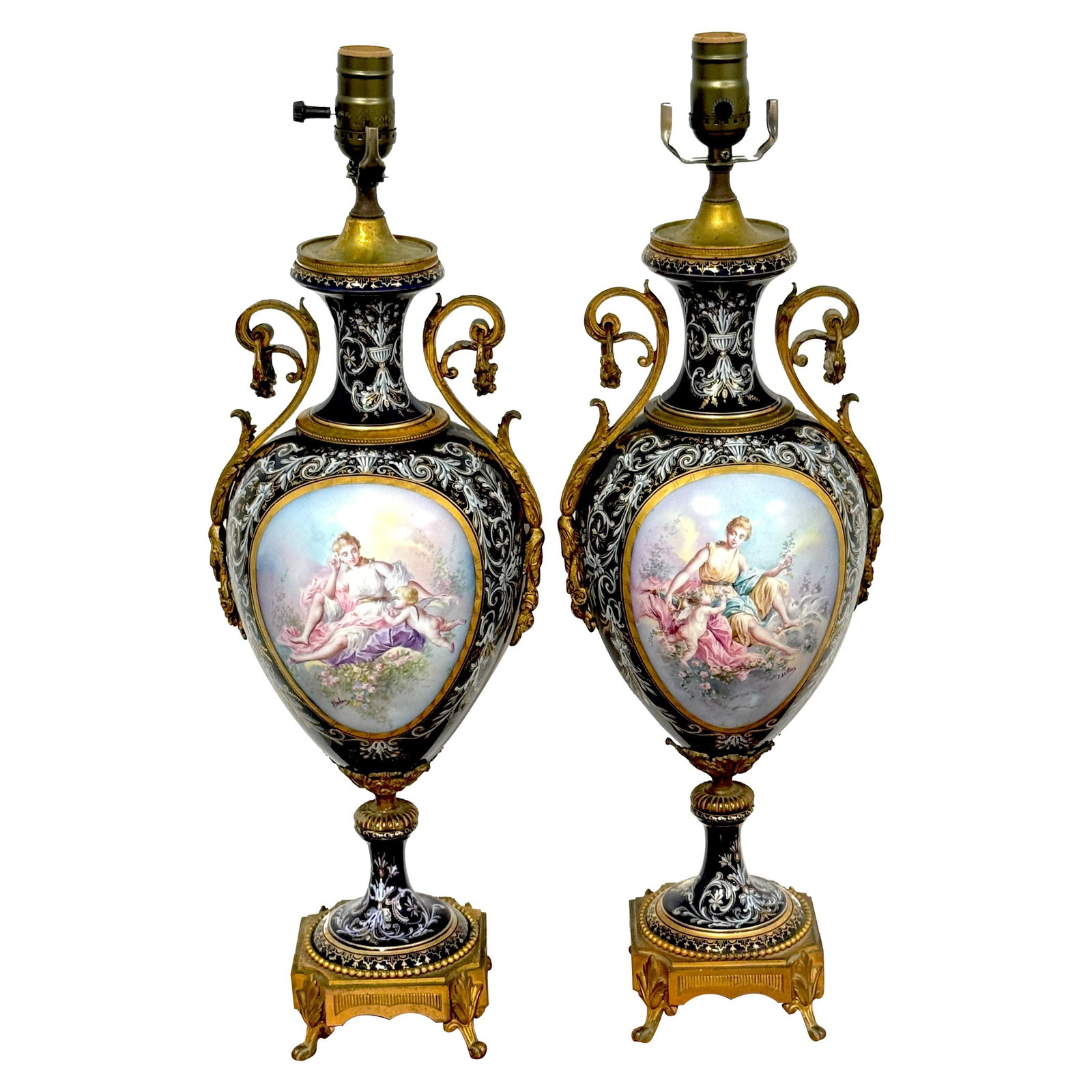 19th Century Ormolu Mounted Sevres Cobalt Urns Converted to Lamps Set of 2: 19th Century Ormolu Mounted Sevres Cobalt Urns Converted to Lamps Set of 2 This exquisite pair of 19th-century Ormolu-mounted Sevres cobalt urns has been beautifully converted into lamps. Originating 