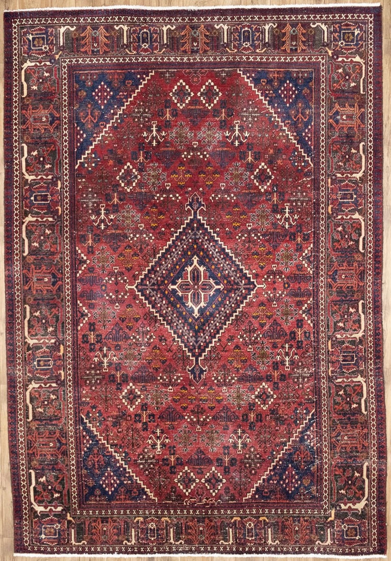 Hand-Knotted Wool Floral Oriental Area Rug 7x10 Ft: Hand-Knotted Wool Floral Oriental Area Rug 7x10 Ft This semi-antique handmade Oriental rug features a traditional floral pattern in rich shades of red, dark brown, cream, gold, and purple-navy. Expert