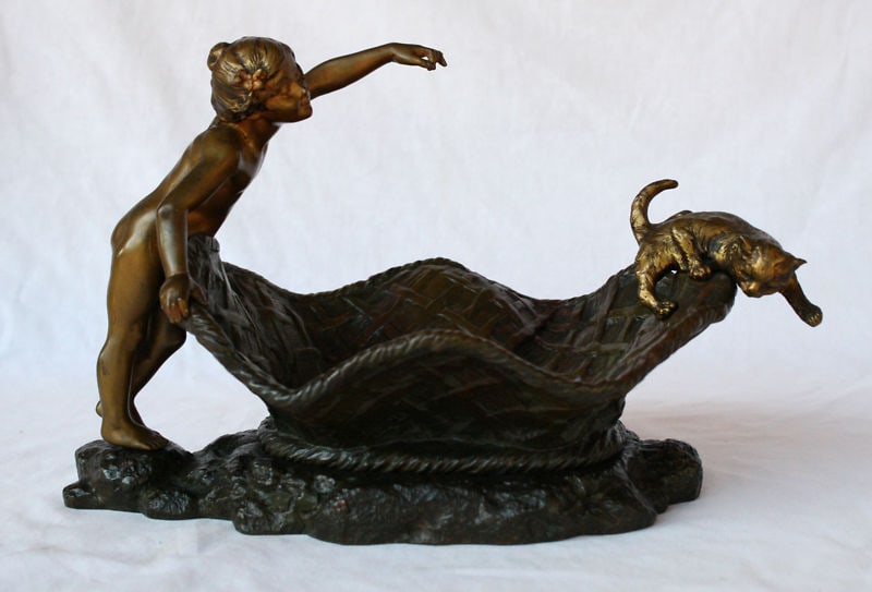 19th Century French Bronze Centerpiece by Charlotte Monginot: 19th Century French Bronze Centerpiece by Charlotte Monginot This exquisite French 19th century bronze center piece dish, created between 1880 and 1900, features a delightful sculpture of a nude boy