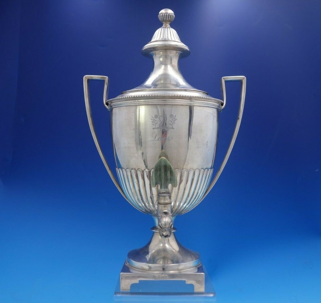 Georgian Sterling Silver Samovar 1806 Coat of Arms Dogs Flowers: Georgian Sterling Silver Samovar 1806 Coat of Arms Dogs Flowers This exquisite English Georgian samovar is crafted from sterling silver and features elegant handles. Made in London in 1806, this stunn