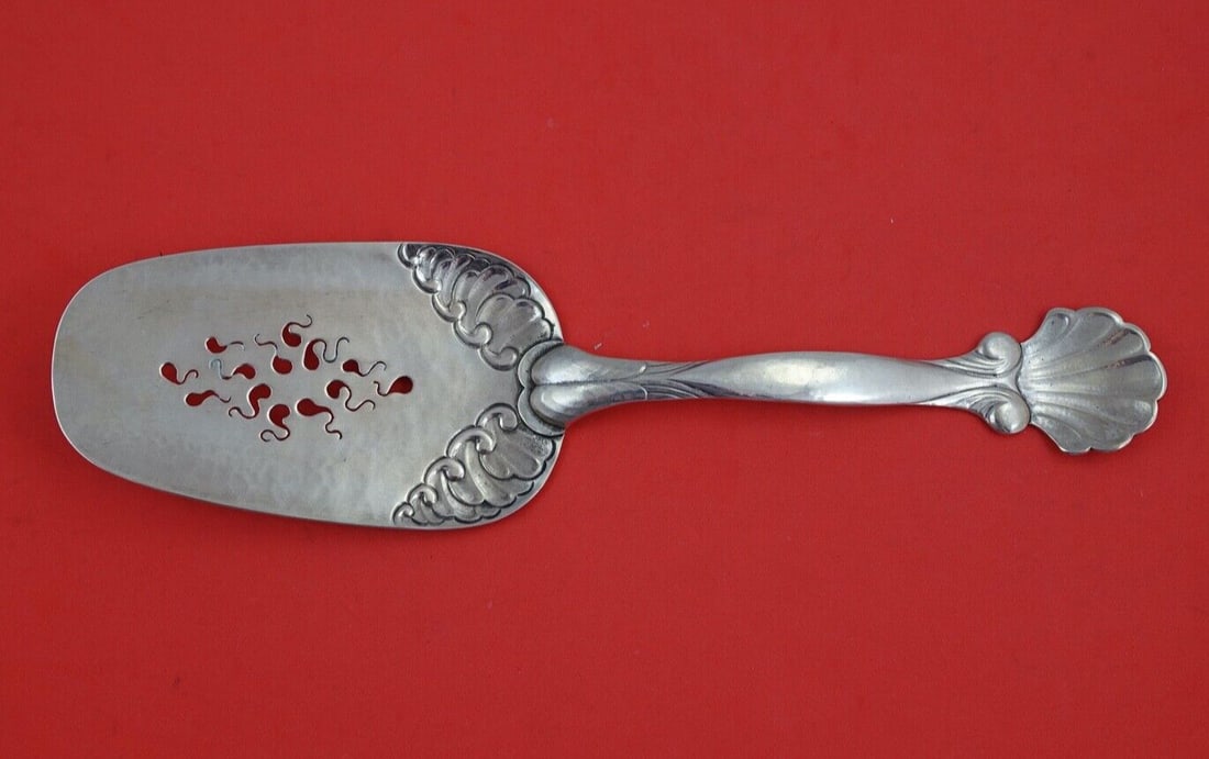 Georg Jensen Ornamental Sterling Silver Fish Server 10 3/4": Georg Jensen Ornamental Sterling Silver Fish Server 10 3/4" This exquisite fish server, crafted by Georg Jensen, showcases the beautiful Ornamental pattern. Made from high-quality sterling silver, it 