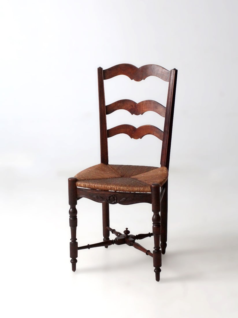 French Provincial Ladderback Chair with Handwoven Rush Seat: French Provincial Ladderback Chair with Handwoven Rush Seat This antique French provincial ladder back chair features gently arched back slats, turned legs, and a hand-woven rush seat in a classic tri