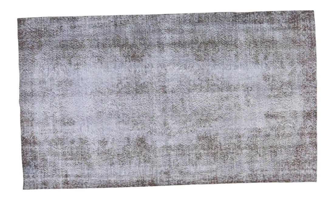5'3" x 9'1" Anatolian Hand Knotted Wool Overdyed Vintage Rug: 5'3" x 9'1" Anatolian Hand Knotted Wool Overdyed Vintage Rug This vintage Turkish Anatolian rug features an overdyed design with natural colors and a fine weave. Hand knotted from organic wool, it sho