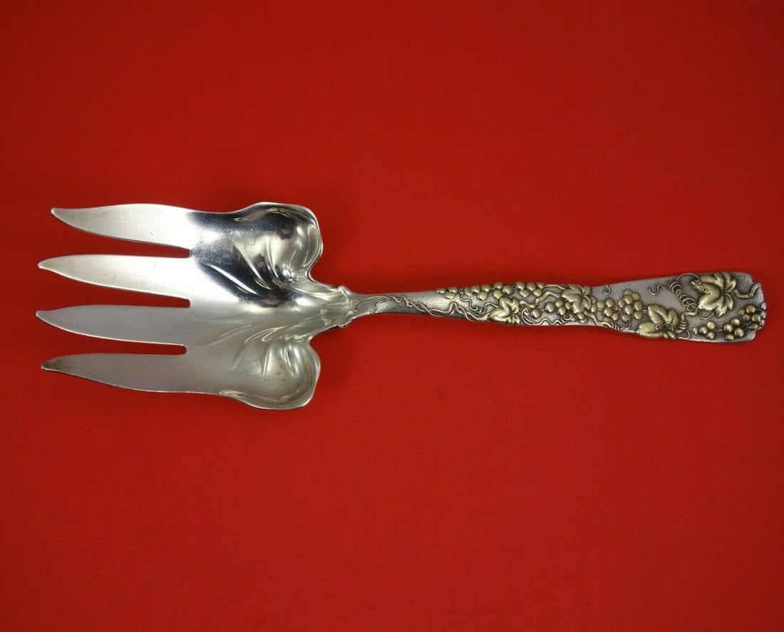 Tiffany & Co Vine Sterling Silver Fish Serving Fork with Gold Grapes 9.5": Tiffany & Co Vine Sterling Silver Fish Serving Fork with Gold Grapes 9.5" This exquisite serving fork from Tiffany & Co. showcases the elegant Vine pattern, featuring intricate gold detailing of grape