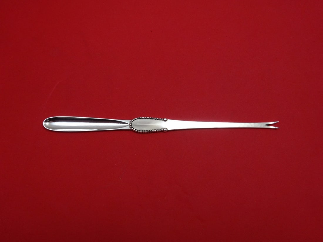 Georg Jensen Beaded Sterling Silver Lobster Pick 7 1/4 Inch: Georg Jensen Beaded Sterling Silver Lobster Pick 7 1/4 Inch Discover the exquisite craftsmanship of this Georg Jensen Lobster Pick, featuring the elegant Beaded pattern. Made from high-quality sterlin