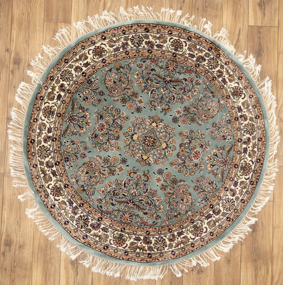 Round Hand-Knotted Wool Floral Area Rug 4'1 x 4'1: Round Hand-Knotted Wool Floral Area Rug 4'1 x 4'1 This handmade round rug features a classic floral Oriental design, crafted from high-quality wool using a hand-knotted technique. Measuring approximat