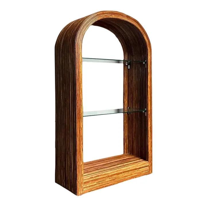 Vintage Boho Arched Rattan Etagere with Glass Shelves: Vintage Boho Arched Rattan Etagere with Glass Shelves Introducing a stunning Vintage Boho Arched Pencil Rattan Etagere, a remarkable piece that embodies the textural innovation of mid-century tropical