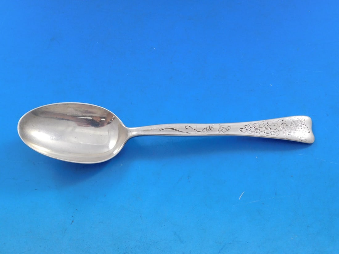 Tiffany & Co. Lap Over Edge Sterling Silver Teaspoon Grapes 6 in: Tiffany & Co. Lap Over Edge Sterling Silver Teaspoon Grapes 6 in This exquisite teaspoon, crafted by Tiffany & Co. in the elegant Lap Over Edge pattern, showcases a stunning acid etched design featuri