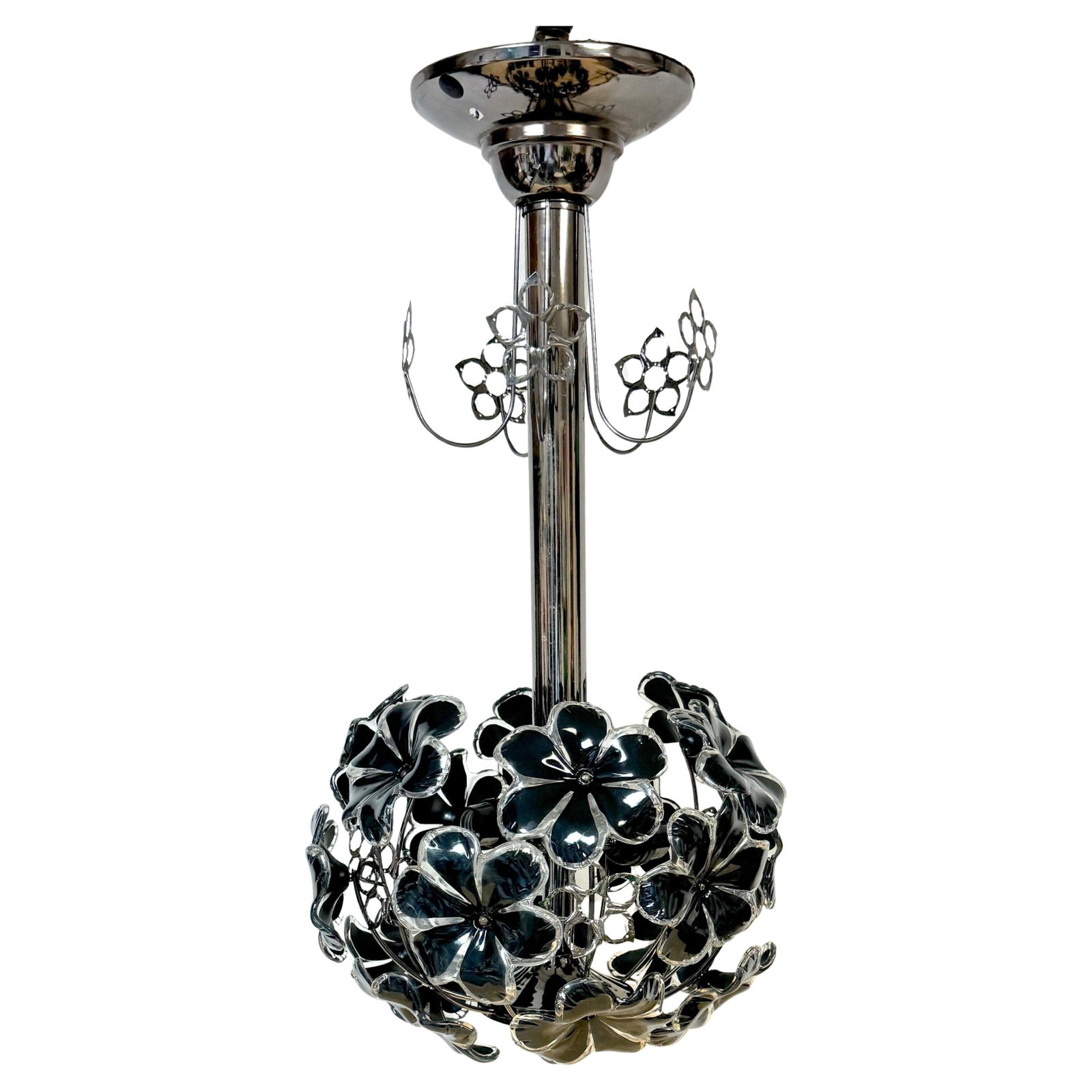 1970s Black and White Lucite Floral Chandelier with Chrome Accents: 1970s Black and White Lucite Floral Chandelier with Chrome Accents This mid-century modern chandelier from the 1970s features a striking black and white floral design crafted from Lucite. The polished