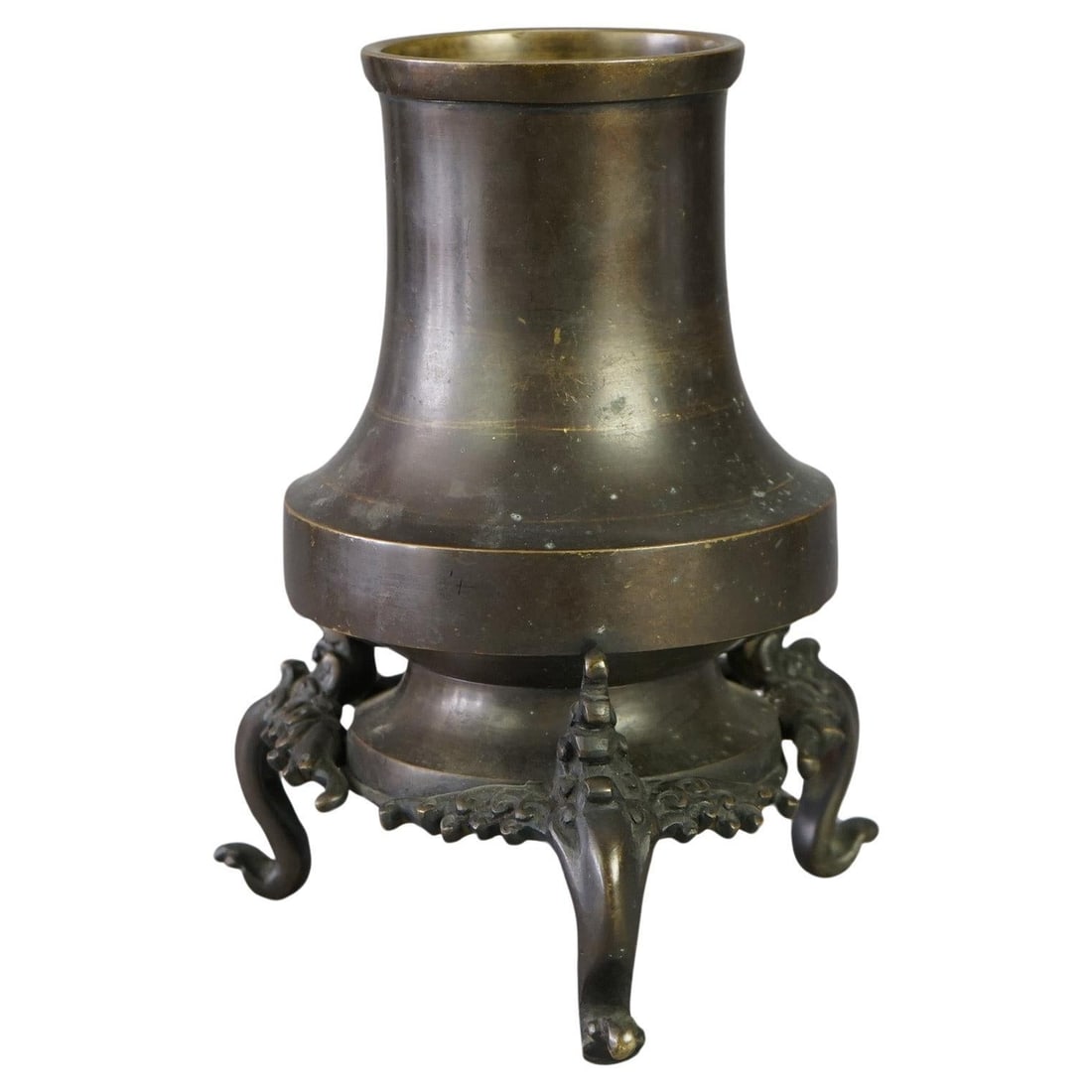 19th Century Asian Bronze Censer with Ornate Footed Base: 19th Century Asian Bronze Censer with Ornate Footed Base This is an antique Oriental bronze censer from the 19th century, crafted in a tower form with a footed base featuring wave or cloud motifs. The