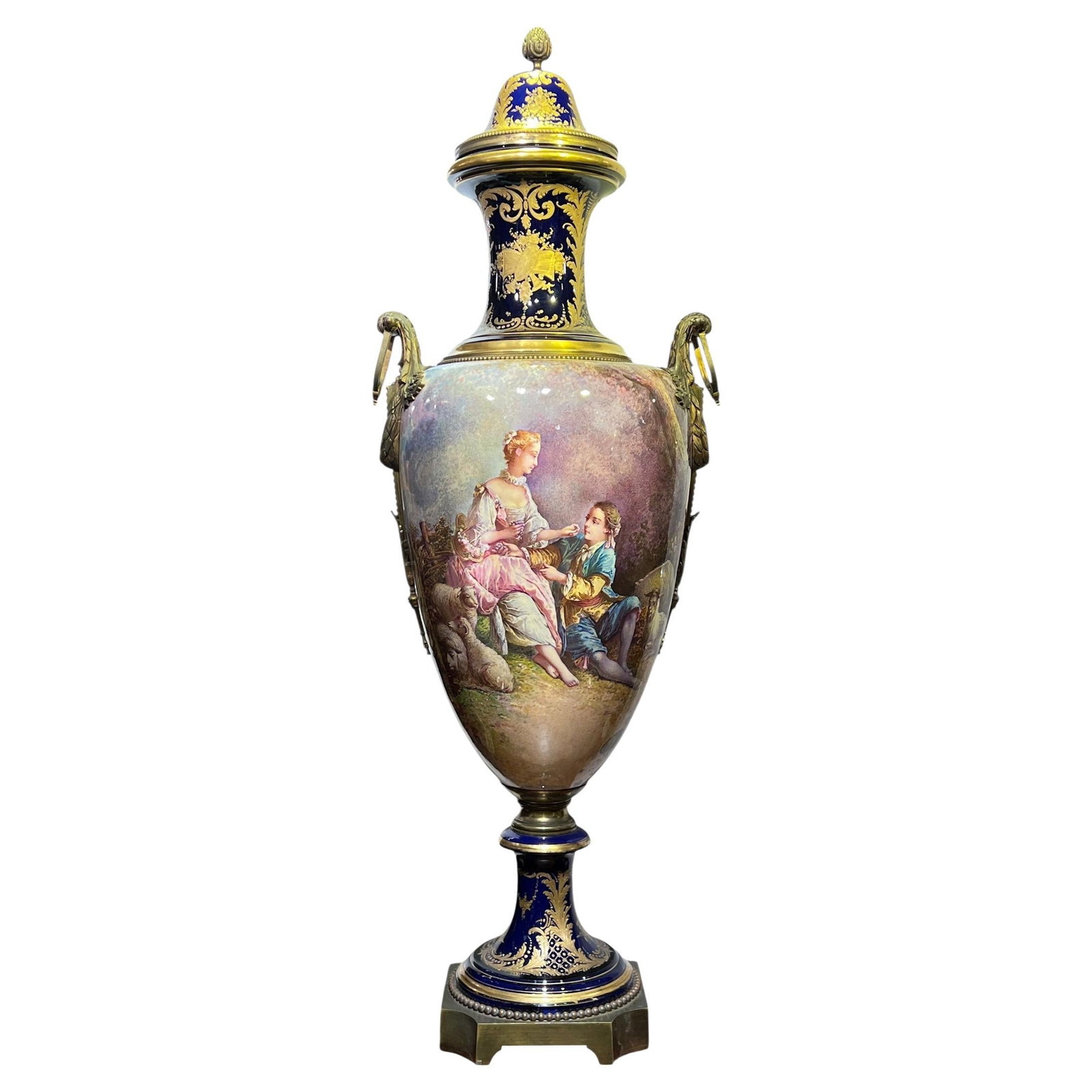 French Sevres Style Porcelain Vase with Gilt Bronze and Boucher Inspired Painting: French Sevres Style Porcelain Vase with Gilt Bronze and Boucher Inspired Painting This is a very large French Sevres style porcelain vase, mounted with gilt bronze and featuring a hand-painted cartouc