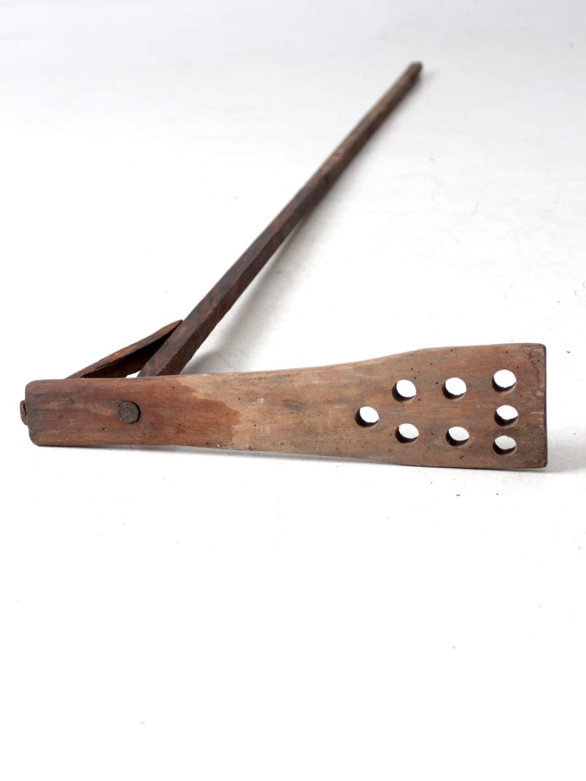 Antique Primitive Laundry Dasher 76.25 Inch Wooden Decor: Antique Primitive Laundry Dasher 76.25 Inch Wooden Decor This antique primitive laundry dasher showcases a long wooden pole with a paddle-style base featuring eight round openings. Originally utilized