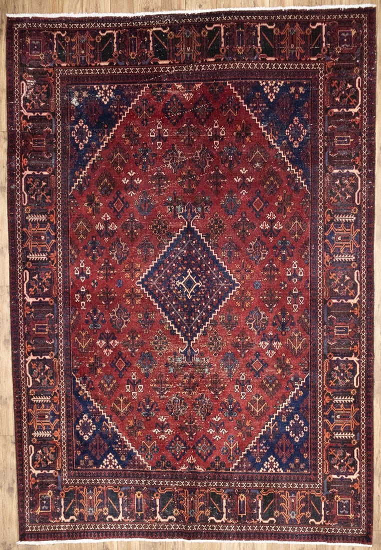 Hand-Knotted Wool Tribal Geometric Area Rug 7x10 Ft: Hand-Knotted Wool Tribal Geometric Area Rug 7x10 Ft This semi-antique tribal geometric wool rug features a hand-knotted construction and a vibrant color palette including red, purple-navy, cream, ligh