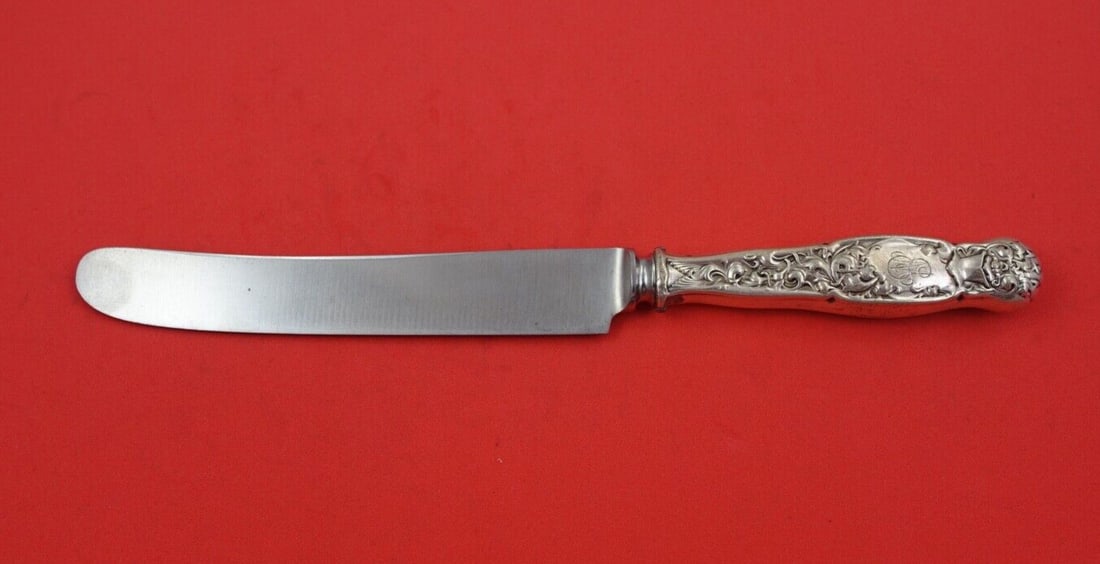 Whiting Heraldic Sterling Silver Knife 9 Inch Antique 1850-1899: Whiting Heraldic Sterling Silver Knife 9 Inch Antique 1850-1899 This elegant knife features a flat handle in the Heraldic pattern by Whiting, crafted from high-quality sterling silver. Measuring 9 inc
