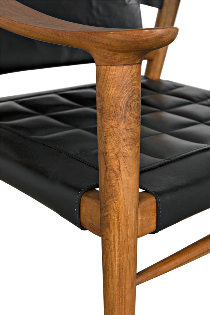 Noir Elegant Teak and Black Leather Chair 31H 25W 27D: Noir Elegant Teak and Black Leather Chair 31H 25W 27D This elegant chair combines the warmth of teak with the sophistication of black leather fabric, creating a stunning addition to any space. With a 