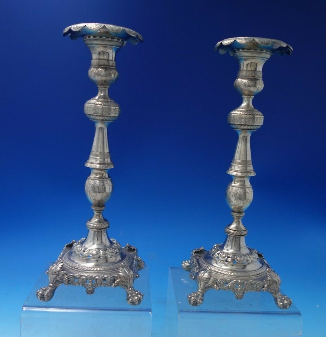 FDG .833 Silver Candlestick Pair Circa 1850 Lion Paw Feet Hand Engraved: FDG .833 Silver Candlestick Pair Circa 1850 Lion Paw Feet Hand Engraved This exquisite pair of FDG .833 silver candlesticks, dating back to circa 1850, features intricate hand engraving and piercing, 