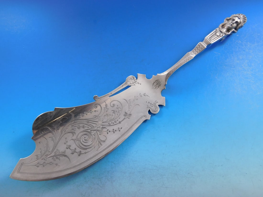 Braverman & Levy Coin Silver Fish Server 12 1/8" 3-D Woman Sculpture: Braverman & Levy Coin Silver Fish Server 12 1/8" 3-D Woman Sculpture This exquisite coin silver fish server, crafted by Braverman & Levy, dates back to the Art Silver period circa 1860-1883. Featuring