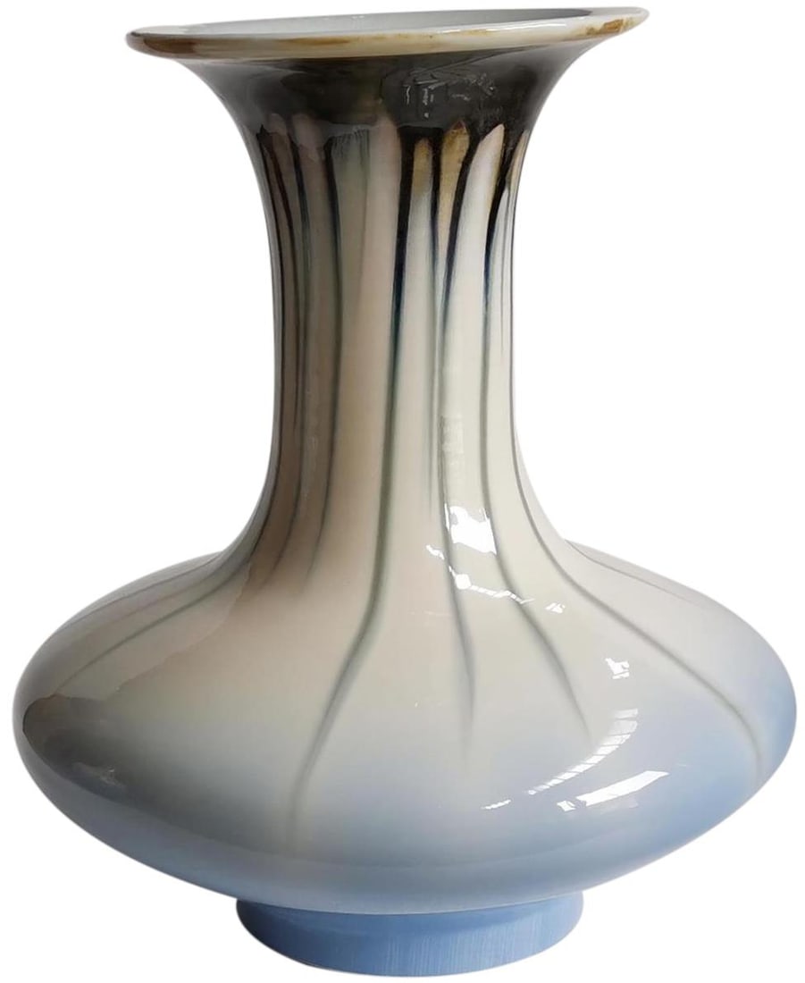 Handmade Ceramic Vase 15.5H with Reactive Glaze: Handmade Ceramic Vase 15.5H with Reactive Glaze This stunning handmade ceramic vase showcases a beautiful reactive glaze finish, making it a unique addition to your home decor. With dimensions of 15.5