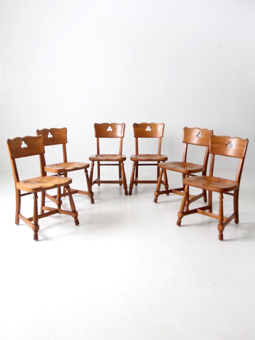 Set of 6 Mid-Century Monterey Dining Chairs with Clover Leaf Cutouts: Set of 6 Mid-Century Monterey Dining Chairs with Clover Leaf Cutouts This exquisite set of six mid-20th century vintage dining chairs showcases a charming Monterey furniture style. Each chair