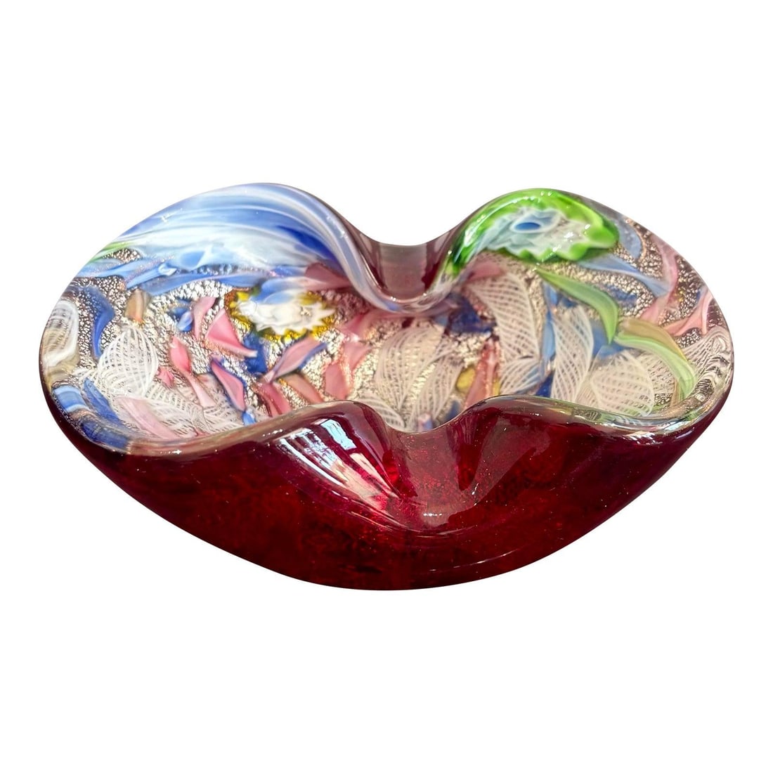 Colorful Art Glass Bowl in the Style of Murano: Colorful Art Glass Bowl in the Style of Murano This vintage art glass bowl showcases a vibrant Murano-inspired design with a deep ruby red base and swirling ribbons of blue, green, pink, and white