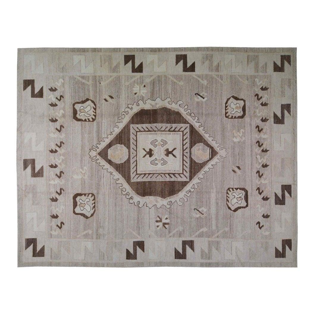 Hand-Knotted Wool Oushak Area Rug Tan 10'3" x 13'3": Hand-Knotted Wool Oushak Area Rug Tan 10'3" x 13'3" This Turkish Oushak wool rug is hand-knotted using traditional techniques, offering a blend of classic craftsmanship and contemporary design. Its so