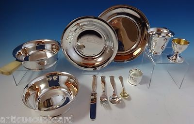 Tiffany Co Sterling Silver 11-Piece Childs Set Gold Washed Egg Cup Spoon: Tiffany Co Sterling Silver 11-Piece Childs Set Gold Washed Egg Cup Spoon This 11-piece child's set by Tiffany & Co. is crafted from sterling silver, featuring a variety of functional and decorative pi