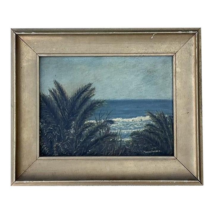 Framed coastal oil seascape on canvas in giltwood frame: Framed coastal oil seascape on canvas in giltwood frame This vintage original oil painting depicts a tranquil seascape with impressionistic brushwork, featuring lush palm fronds in the foreground, a r