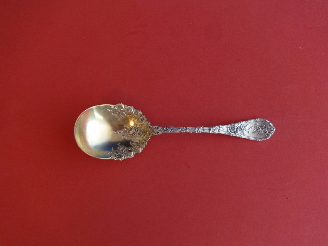 Durgin Dauphin Sterling Silver Preserve Spoon Gold Washed Floral Design 7 1/4": Durgin Dauphin Sterling Silver Preserve Spoon Gold Washed Floral Design 7 1/4" This exquisite serving spoon, crafted by Durgin in the 1850-1899 period, showcases the beautiful Dauphin pattern. Made