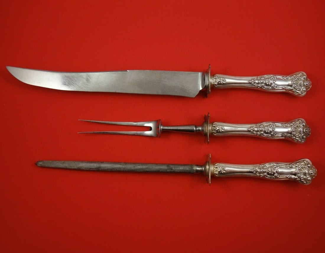 Birks New King Sterling Silver 3-Piece Carving Set: Birks New King Sterling Silver 3-Piece Carving Set Elevate your dining experience with the New King by Birks 3-Piece Sterling Silver Roast Carving Set. This exquisite set features a sterling silver ho